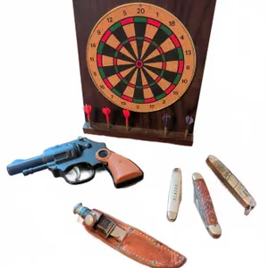 Dartboard, Toy Cap Gun, Pocket Knives and Sheathed Fixed Blade Knife Lot