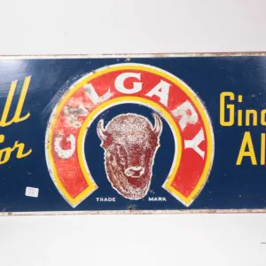 Vintage metal and porcelain "Call for Calgary Ginger Ale", 13"H X 30" W