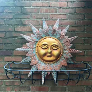 Large metal hanging planter and metal sun