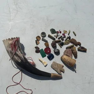 This & that - powder horn, broken arrowheads, flint, rocks