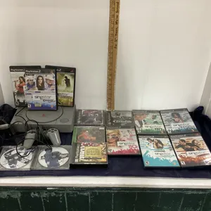 PLAYSTATION GAME CONSOLE W/ CONTROLLER & PLAYSTATION 1 & 2 GAMES