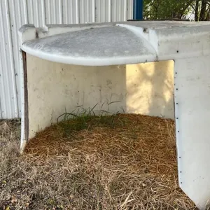 Poly tank converted into calf shelter