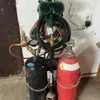 Oxy/acetylene tanks, cart and hoses