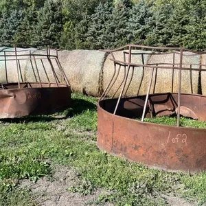 (2) Skirted hay saver rnd bale feeders (both need repair)