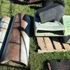 Pallet w/ (2) Prairie pride poly hog feeders, (1) black poly hog feeder, (2) small metal troughs