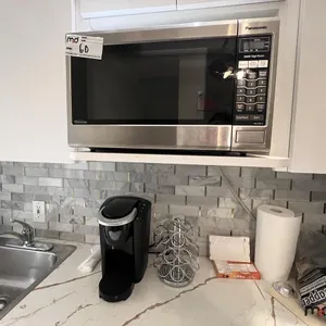 Panasonic Microwave, Keurig Coffee Maker, Cups & Water Cooler
 UNRESERVED