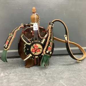HIDE ON COVERED FLASK W/ STITCHED FLORAL DETAIL