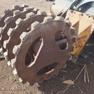 Excavator compaction wheel