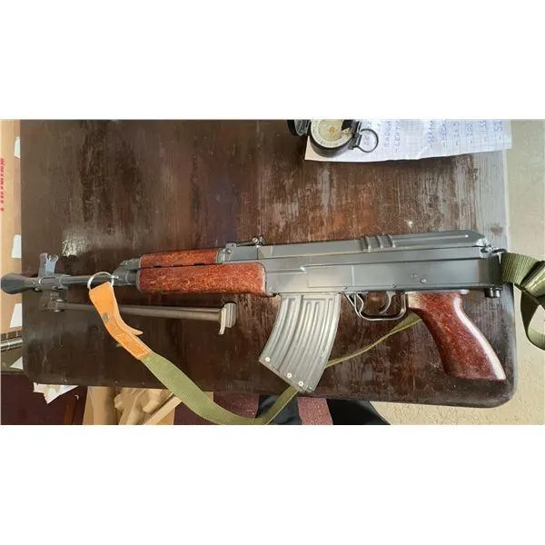deactivated firearms and military collectibles, featuring rifles, pistols, revolvers, and a German flare pistol