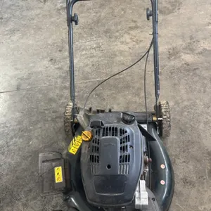Yardworkers push lawnmower
