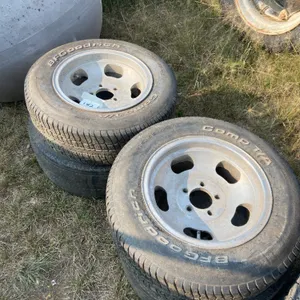 4 - BF GOODRICH P215/65R15 TIRES W/ RIMS