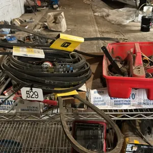 Assortment of belts, wrenches, tools
