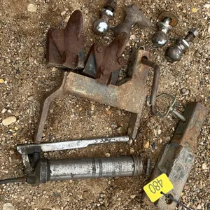 Assorted hitches, balls and grease gun