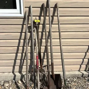 Assorted spades and yard tools