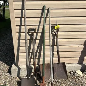 Assorted shovels and yard tools