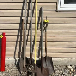 Assorted shovels and yard tools