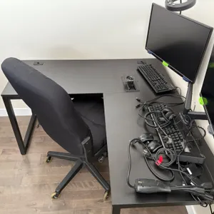 Office desk with chair and computer monitors