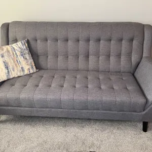 Upholstered Button Couch With Throw Pillow