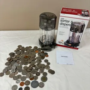 Assortment of international currency and coin sorter
