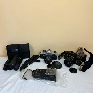 2 Pentax Cameras with Accessories & 2 Pairs Bushnell Binoculars