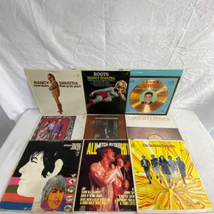 9 LP's featuring Nancy Sinatra, Elvis, Beach Boys, Cat Stevens