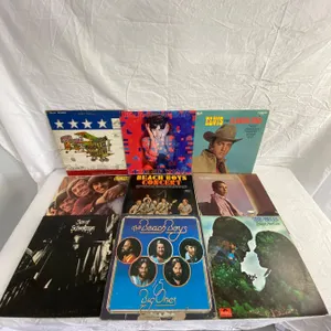 9 LP's featuring Paul Simon, Elvis, Paul McCartney, Beach Boys, Monkees