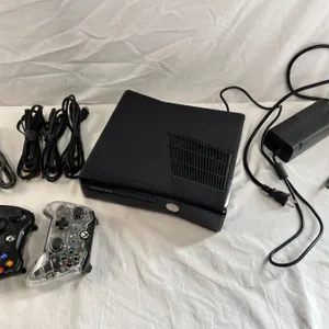 X Box 360  Console with 2 Controllers, Power Cord (Turns On)