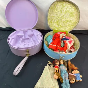 Carrying Cases with vintage doll clothes