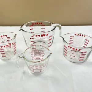 4 Pyrex Measuring Cups