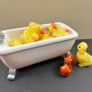 Bath tub and candle rubber ducks