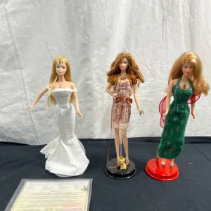 3 Barbies With Stands