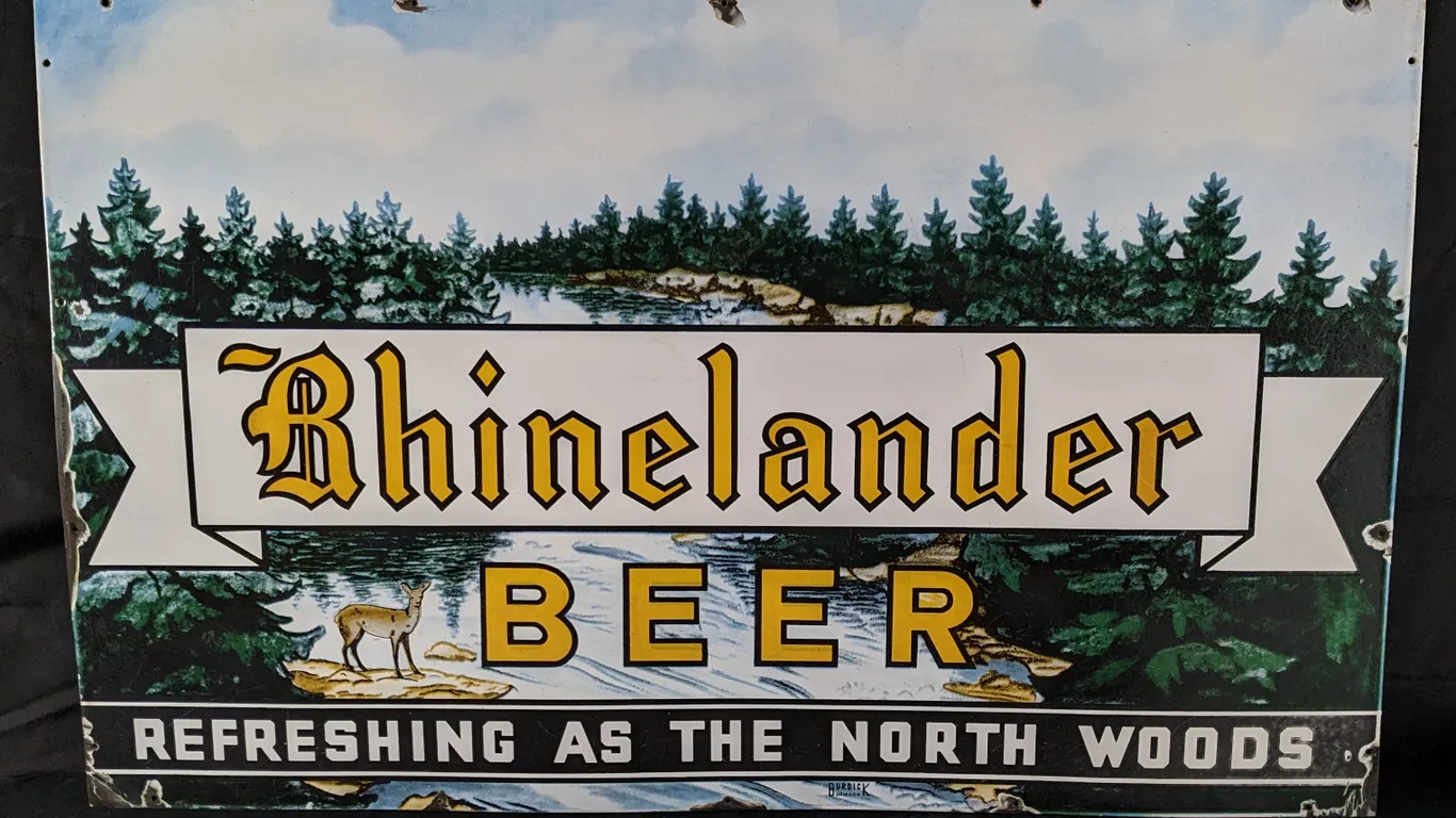 PORCELAIN SIGN REFRESHING AS THE NORTH WOODS RHINELANDER BEER WISCONSIN