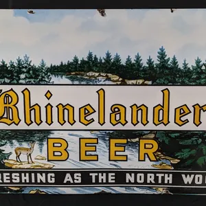 PORCELAIN SIGN REFRESHING AS THE NORTH WOODS RHINELANDER BEER WISCONSIN