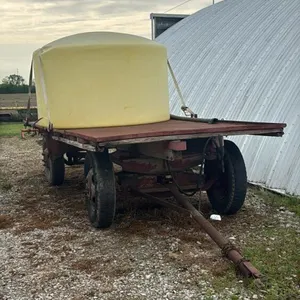 16FT X 7FT FLAT RACK WAGON WITH 1000 GALLON POLY TANK