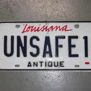 UNSAFE1 ANTIQUE LOUISIANA LICENSE PLATE