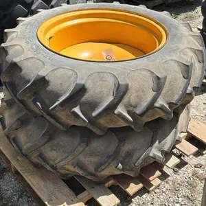PAIR OF 11.2-24 TIRES ON 8 BOLT RIMS
