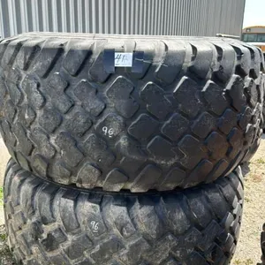 TWO UNMATCHED TIRES 30.5LR32