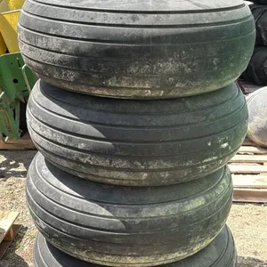 (4) AMERICAN FARMER IMPLEMENT TIRES ON 8 BOLT RIMS