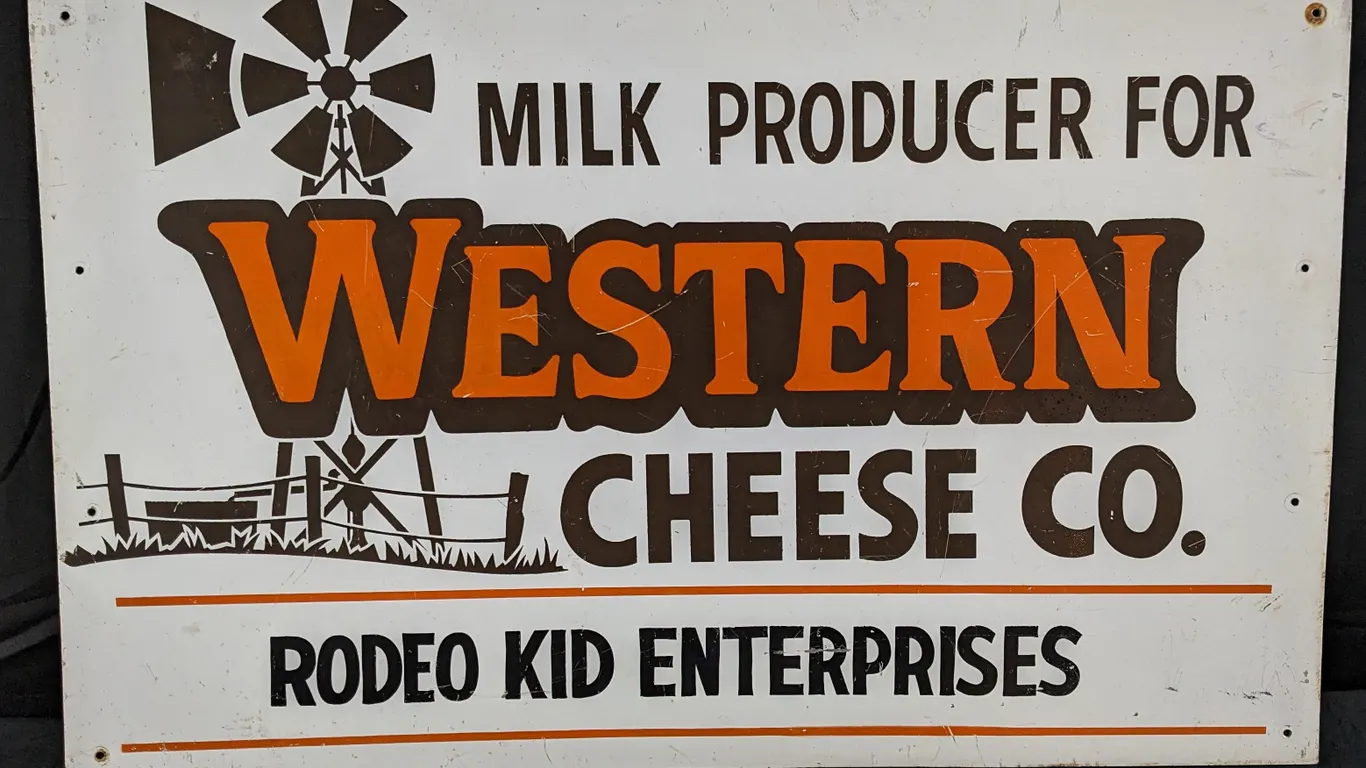 MILK PRODUCER FOR WESTERN CHEESE CO SIGN RODEO KID ENTERPRISES (2 SIDED)