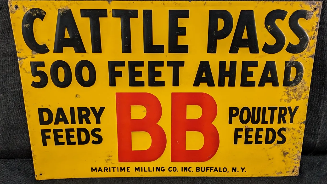 EMBOSSED TIN SIGN CATTLE PASS 500 FEET AHEAD BB DAIRY & POULTRY FEEDS MARITIME MILLING CO BUFFALO NEW YORK