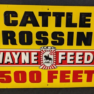 NOS EMBOSSED TIN SIGN CATTLE CROSSING WAYNE FEEDS 500 FEET