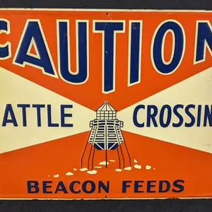 EMBOSED TIN SIGN CAUTION CATTLE CROSSING BACON FEEDS