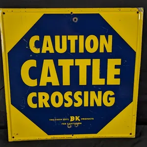 TIN SIGN CAUTION CATTLE CROSSING THIS FARM USES B-K PRODUCTS FOR SANITATION