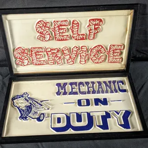 2 EMBOSSED PLASTIC SIGNS MECHANIC ON DUTY & SELF SERVICE