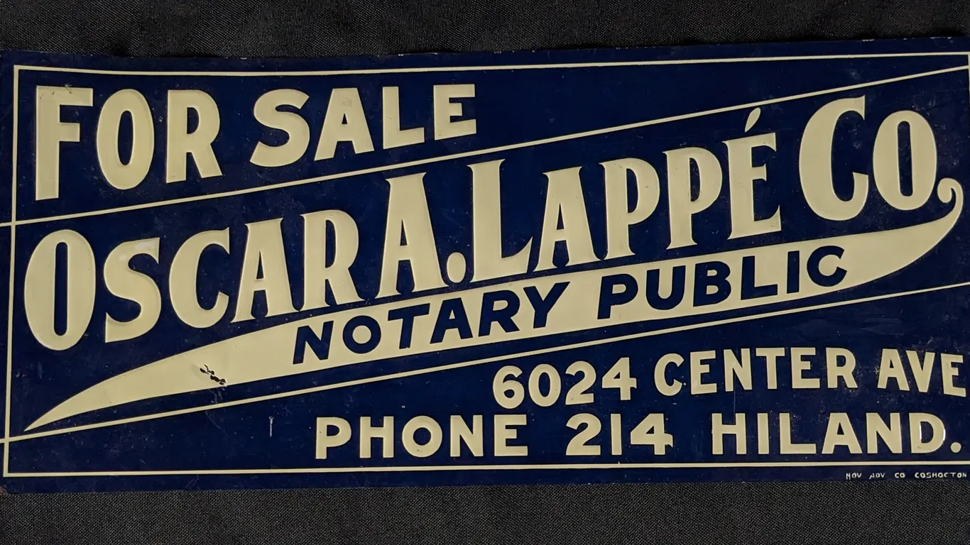 EMBOSSED TIN SIGN OSCAR A. LAPPE' CO NOTARY PUBLIC