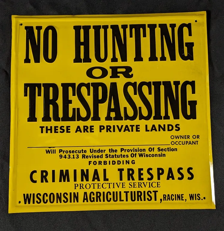 NOS EMBOSSED TIN SIGN WISCONSN AGRICULTURIST RACINE WISCONSIN NO HUNTING OR TRESPASSING
