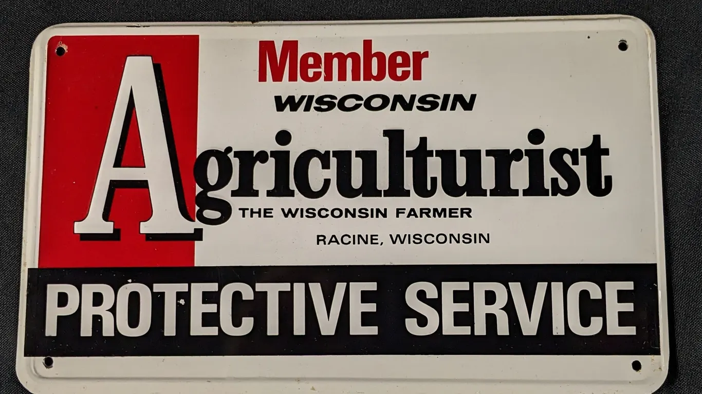 EMBOSSED TIN SIGN WISCONSIN AGRICULTURIST PROTECTIVE SERVICE