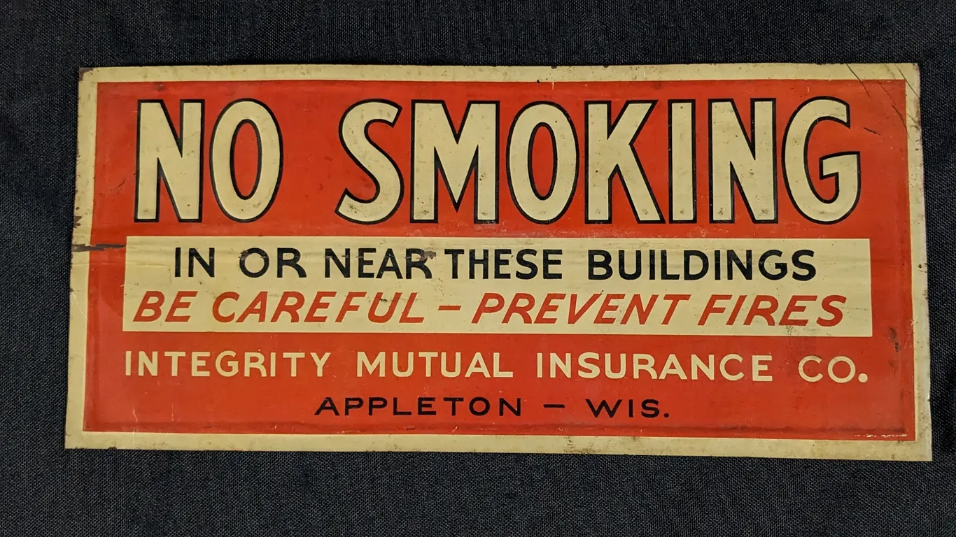 EMBOSSED TIN SIGN NO SMOKING INTEGRITY MUTUAL INSURANCE CO APPLETON WISCONSIN