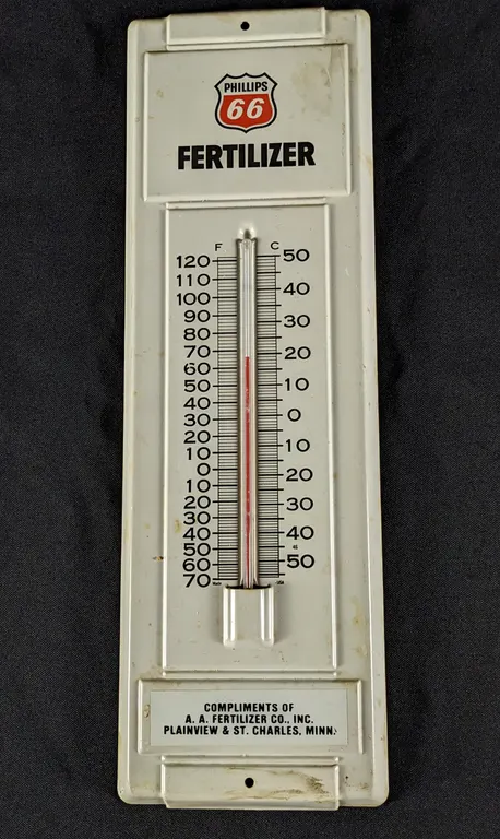 TIN THRMOMETER SIGN PHILLIPS 66 FERTILIZER PLAINVIEW & ST CHARLES MINNESOTA