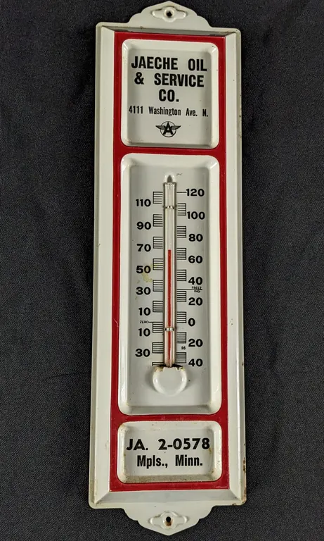 TIN THERMOMETER SIGN ASSOCIATED FLYING A JAECHE OIL & SERVICE CO MINNEAPOLIS MINNESOTA